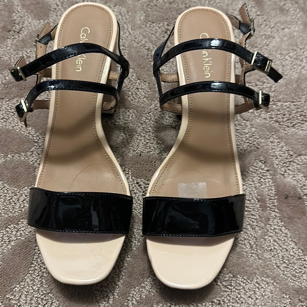 Calvin Klein heeled sandle. Size 9. Tan and black with gold buckles.
